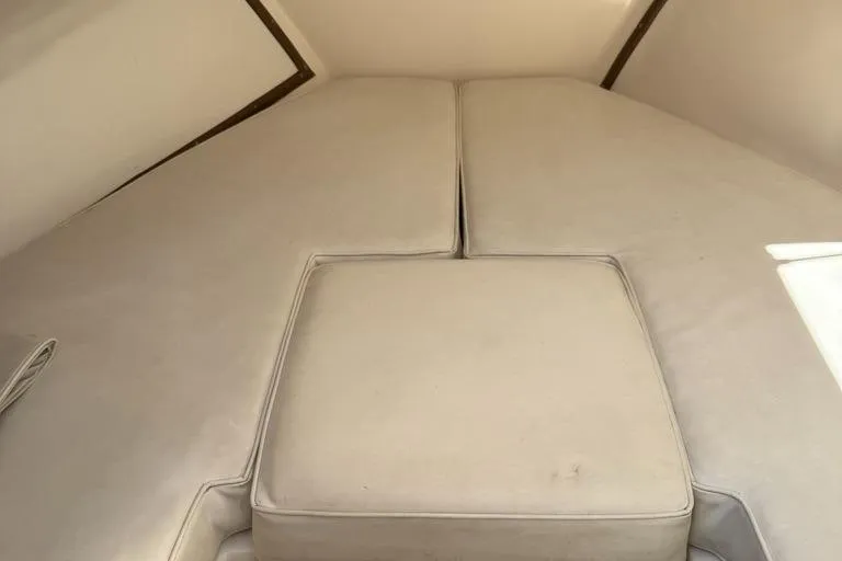 Slide: The Image of Interior cabin of 1986 Dusky 26 Custom boat with beige cushions. - 21