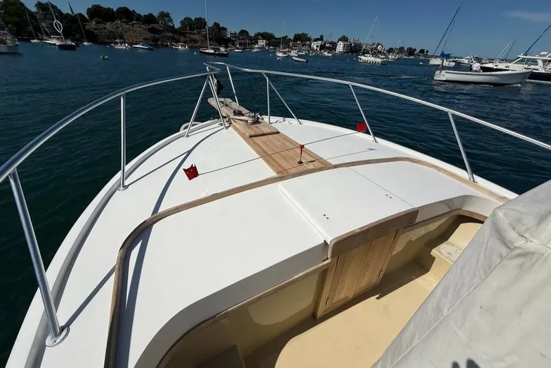 Slide: The Image of 1986 Dusky 26 Custom boat deck with scenic harbor view. - 6