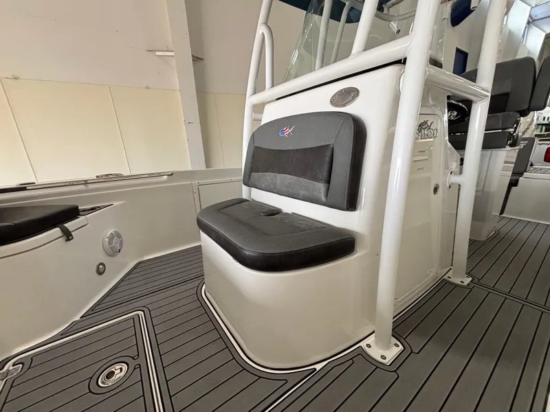 Slide: The Image of 2022 Crevalle 26 HCO boat seats with American flag fish logo, gray upholstery. - 10