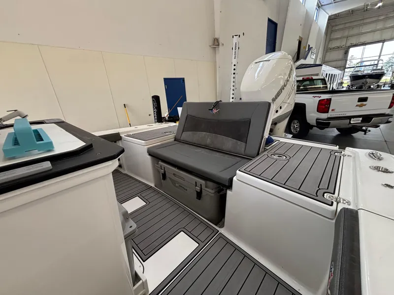 Slide: The Image of 2022 Crevalle 26 HCO boat interior with cushioned seating and sleek design. - 12