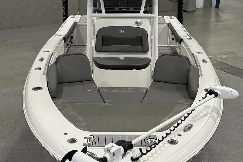 Slide: The Image of 2022 Crevalle 26 HCO boat interior with seating and storage, displayed indoors. - 14