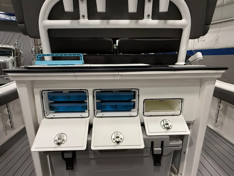 Slide: The Image of 2022 Crevalle 26 HCO boat dashboard with dual Simrad displays and chrome steering wheel. - 18