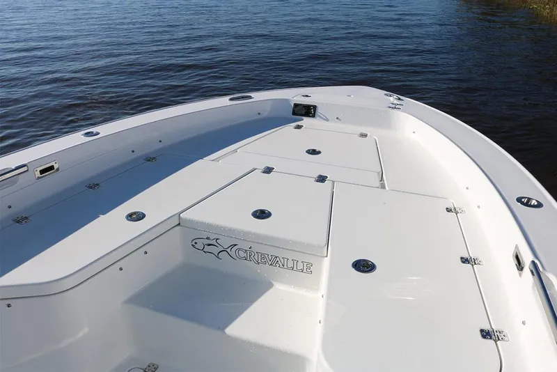 Slide: The Image of 2022 Crevalle 26 HCO boat storage compartments with open lids and organized interior. - 20