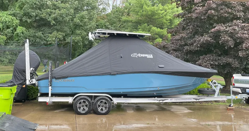 Slide: The Image of 2022 Crevalle 26 HCO boat on trailer in indoor garage setting. - 4