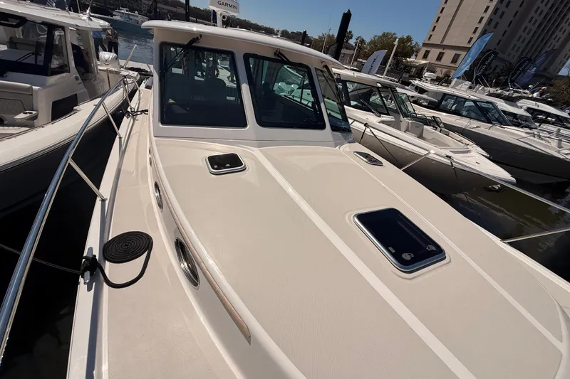 Slide: The Image of 2026 Back Cove 372 yacht docked at marina, showcasing sleek design and modern features. - 18