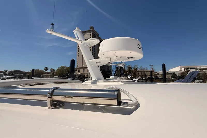 Slide: The Image of 2026 Back Cove 372 yacht with radar equipment against a clear blue sky. - 19