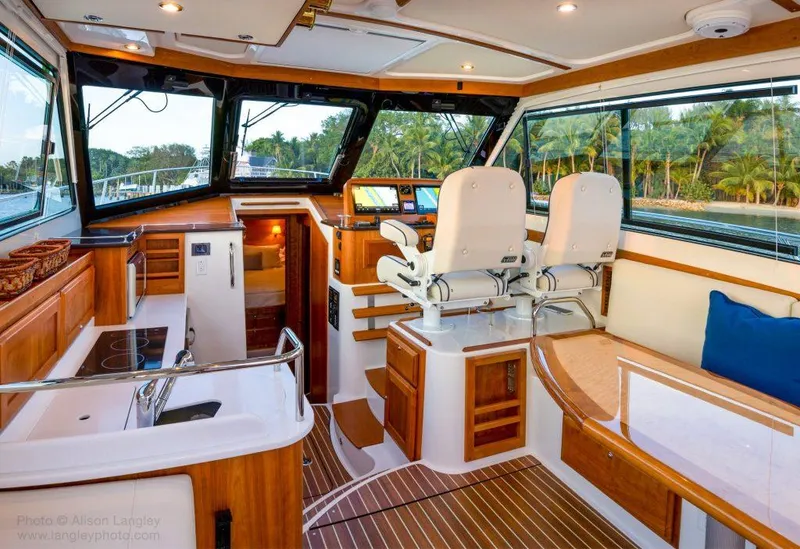 Slide: The Image of Luxurious interior of 2026 Back Cove 372 yacht with modern helm and seating. - 25