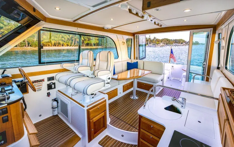 Slide: The Image of Luxurious interior of 2026 Back Cove 372 yacht with elegant seating and scenic water view. - 26