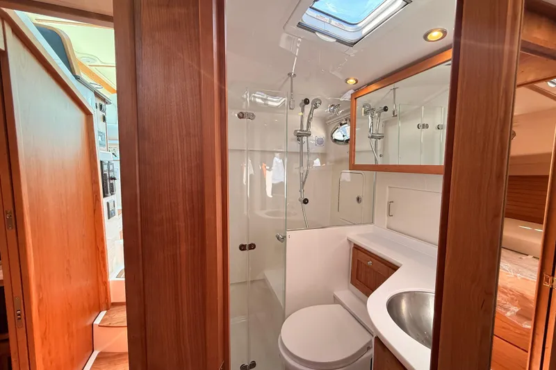 Slide: The Image of Luxurious bathroom interior of 2026 Back Cove 372 yacht with wood accents and modern fixtures. - 45