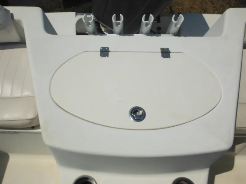 Slide: The Image of 2004 Hydra-Sports Lightning 202 DC boat deck with storage compartment and rod holders. - 17