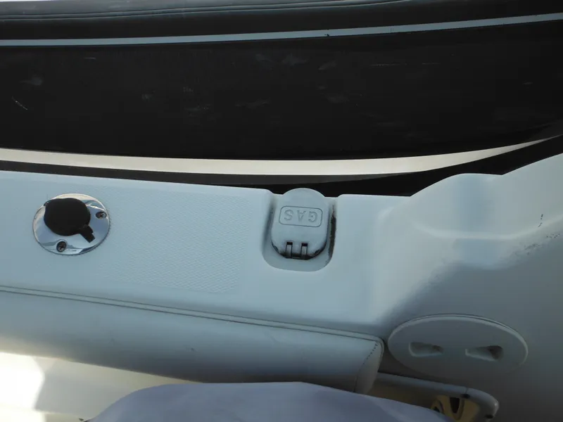 Slide: The Image of 2004 Hydra-Sports Lightning 202 DC boat gas cap and fuel compartment detail. - 27