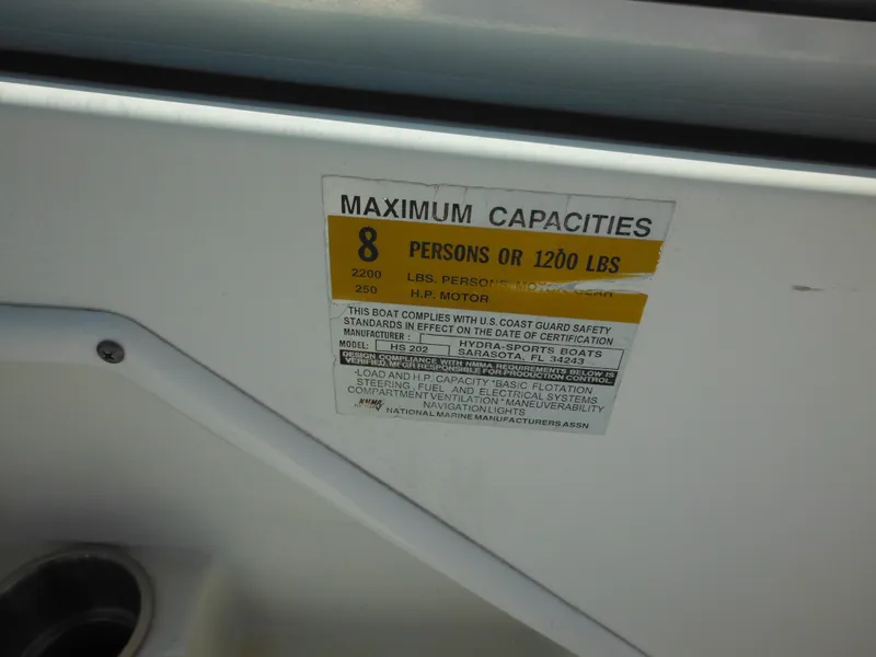 Slide: The Image of 2004 Hydra-Sports Lightning 202 DC capacity label, maximum 8 persons or 1200 lbs. - 29