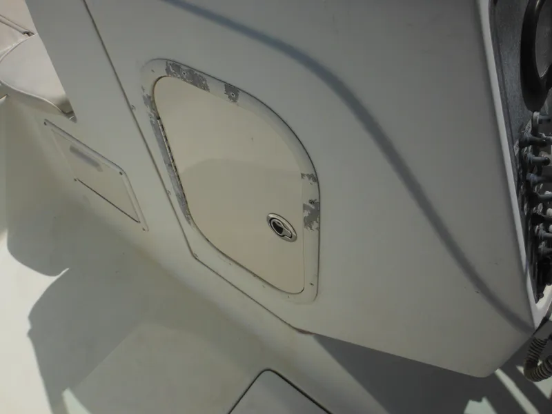 Slide: The Image of 2004 Hydra-Sports Lightning 202 DC boat interior with storage compartment detail. - 33