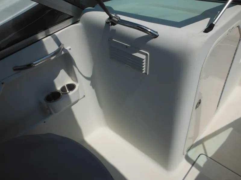 Slide: The Image of 2004 Hydra-Sports Lightning 202 DC boat interior with cup holders and sleek design. - 39