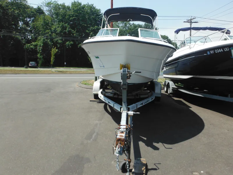 Slide: The Image of 2004 Hydra-Sports Lightning 202 DC boat on trailer, parked outdoors. - 6