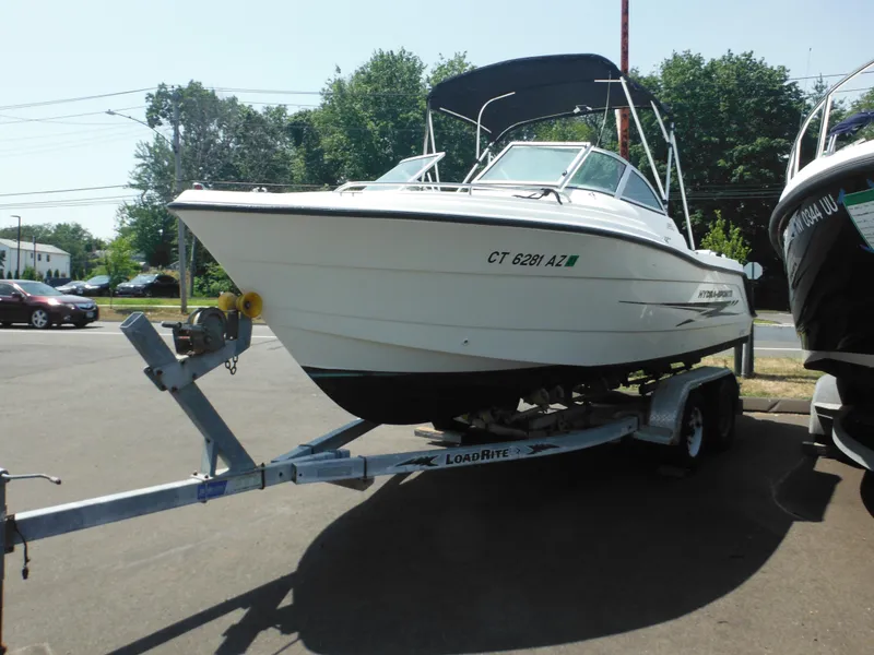 Slide: The Image of 2004 Hydra-Sports Lightning 202 DC boat on trailer, parked outdoors. - 7