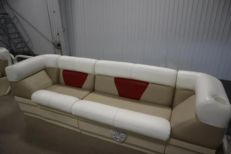 Slide: The Image of 2008 Bentley Pontoons 240 CRUISE boat seating with beige and white upholstery, red accents. - 12