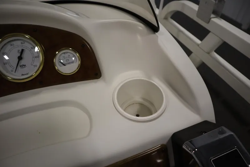 Slide: The Image of Dashboard of 2008 Bentley Pontoons 240 CRUISE with gauges and cup holder. - 22