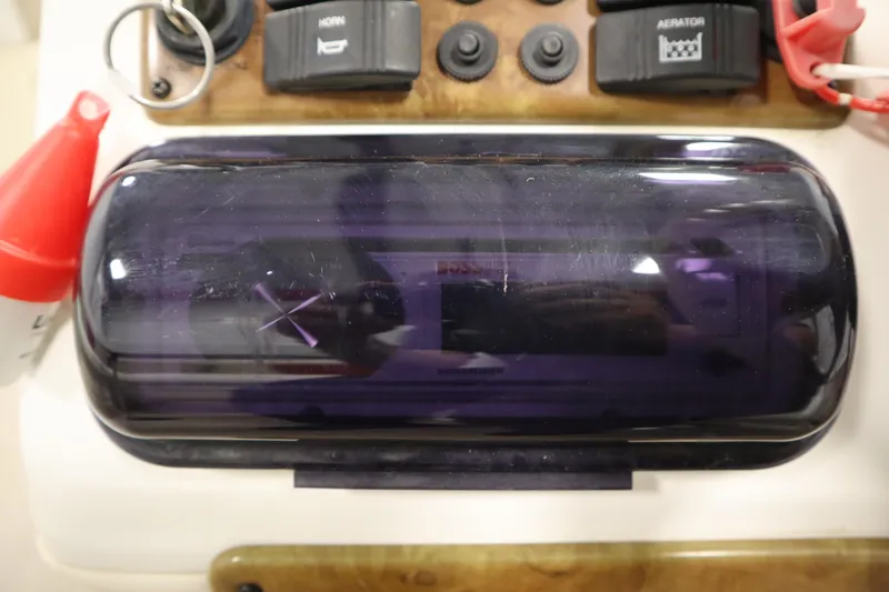 Slide: The Image of Control panel of a 2008 Bentley Pontoons 240 CRUISE with switches and key. - 24