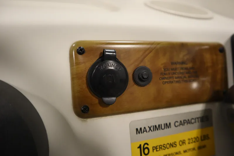 Slide: The Image of 2008 Bentley Pontoons 240 CRUISE dashboard with 12V marine socket and capacity warning. - 26