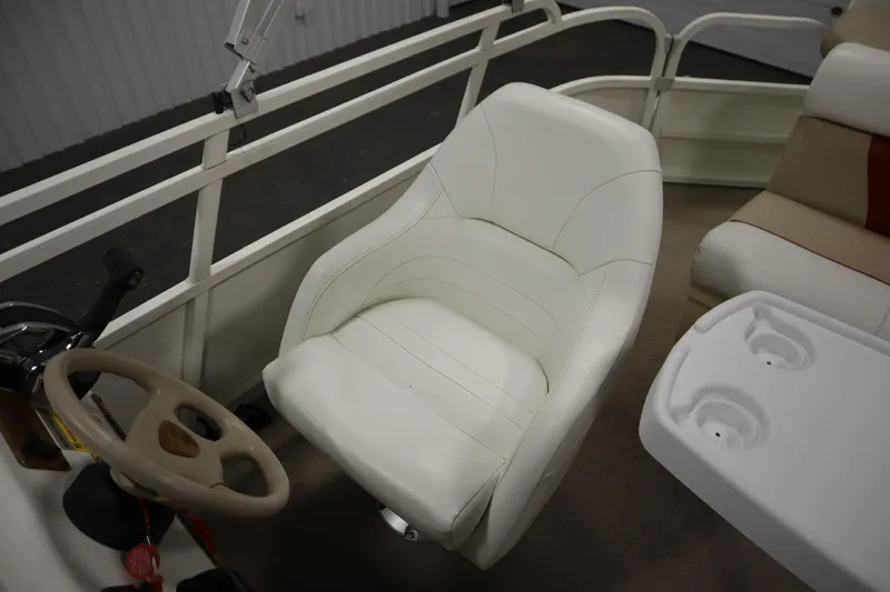 Slide: The Image of 2008 Bentley Pontoons 240 CRUISE interior with white captain's chair and steering wheel. - 29
