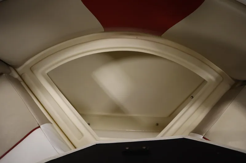 Slide: The Image of Interior view of a 2008 Bentley Pontoons 240 CRUISE boat, showcasing seating and storage. - 34