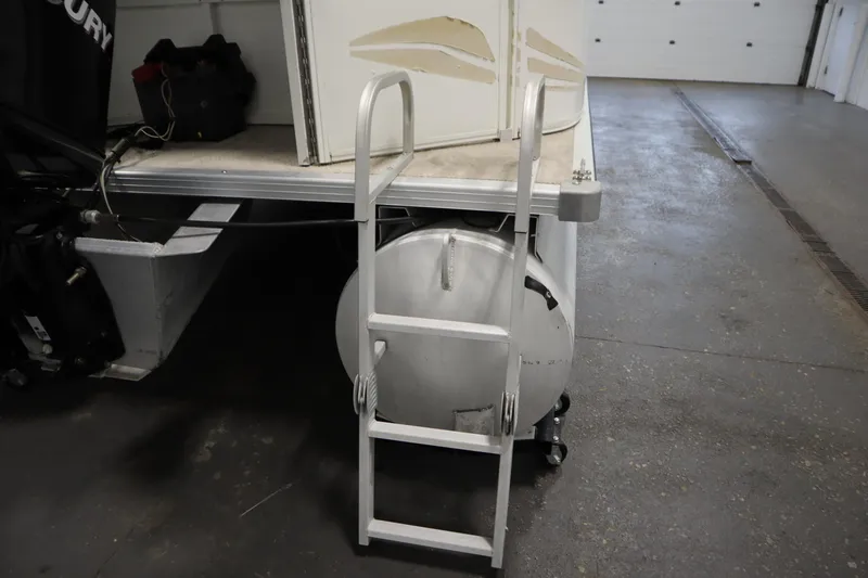 Slide: The Image of 2008 Bentley Pontoons 240 CRUISE with ladder and Mercury engine in garage. - 39