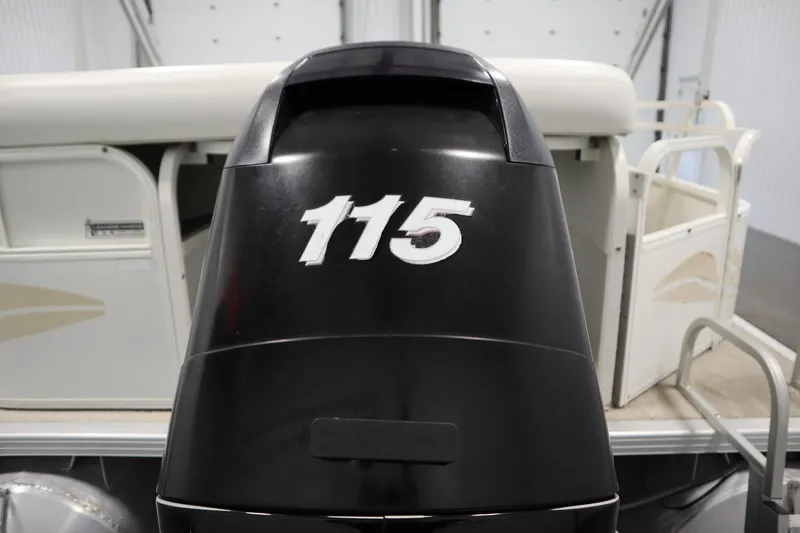 Slide: The Image of 2008 Bentley Pontoons 240 CRUISE with 115 horsepower outboard motor in a garage setting. - 42