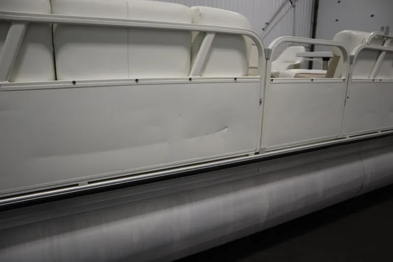 Slide: The Image of 2008 Bentley Pontoons 240 CRUISE, white seating and railing detail, indoor setting. - 46