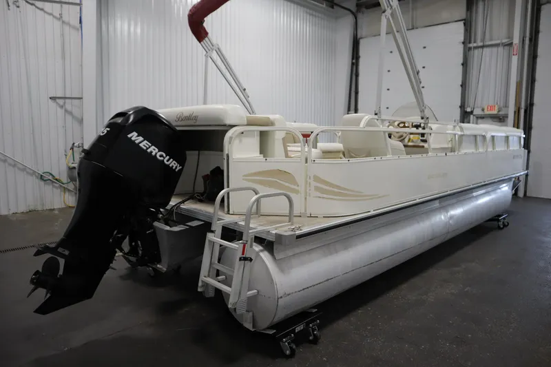 Slide: The Image of 2008 Bentley Pontoons 240 CRUISE with Mercury engine in a storage facility. - 5