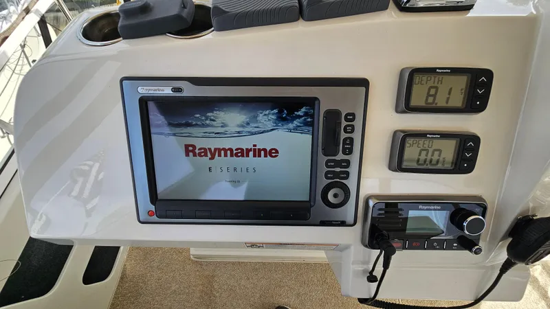 Slide: The Image of 1997 Carver 355 Motor Yacht dashboard with Raymarine E Series navigation system. - 14