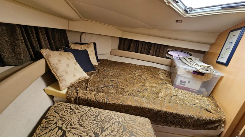 Slide: The Image of Cozy interior of 1997 Carver 355 Motor Yacht with elegant bedding and decorative pillows. - 25