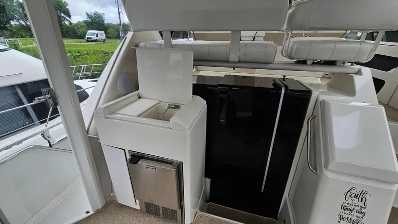 Slide: The Image of 1997 Carver 355 Motor Yacht interior with seating and storage compartments. - 6