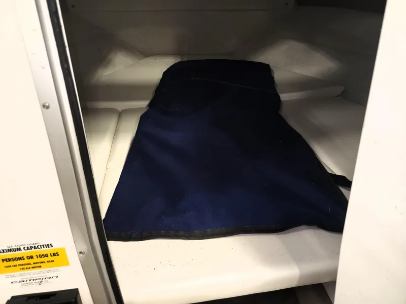 Slide: The Image of Interior cabin of 1999 Campion Explorer 552 boat with blue cushion. - 4