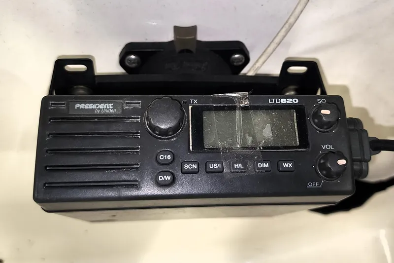 Slide: The Image of President LTD820 radio in a 1999 Campion Explorer 552 boat, featuring control knobs and display. - 8