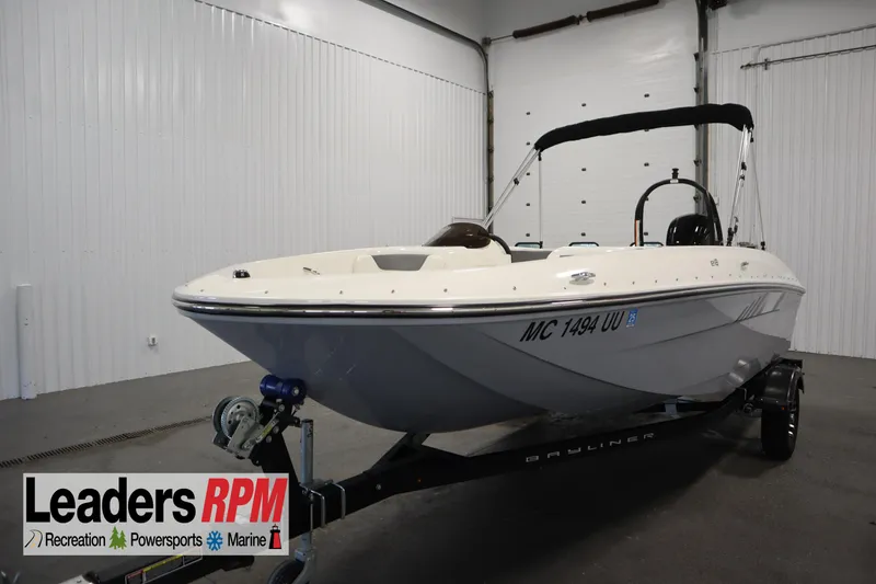 Slide: The Image of 2022 Bayliner E18 Element boat on trailer in indoor showroom. - 1