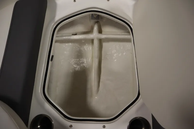 Slide: The Image of 2022 Bayliner E18 Element boat storage compartment, open and empty. - 13