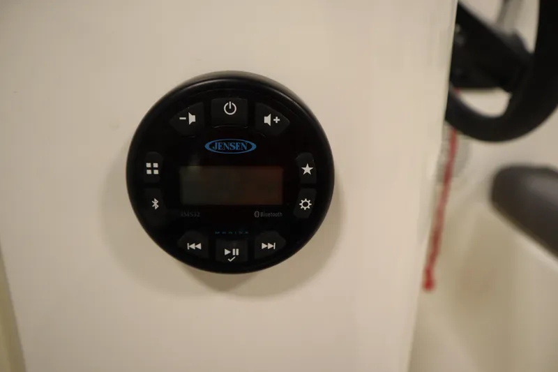 Slide: The Image of Jensen audio control panel on 2022 Bayliner E18 Element boat. - 17