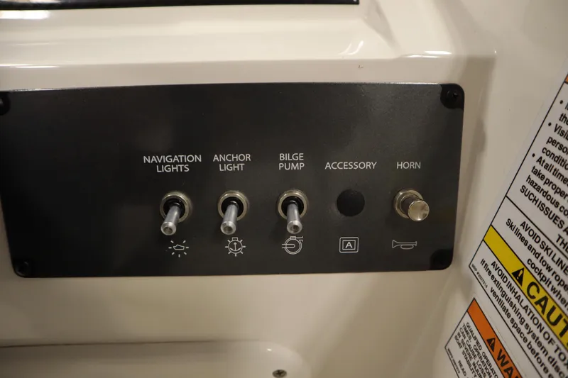 Slide: The Image of Control panel of 2022 Bayliner E18 Element boat with switches for lights and horn. - 21