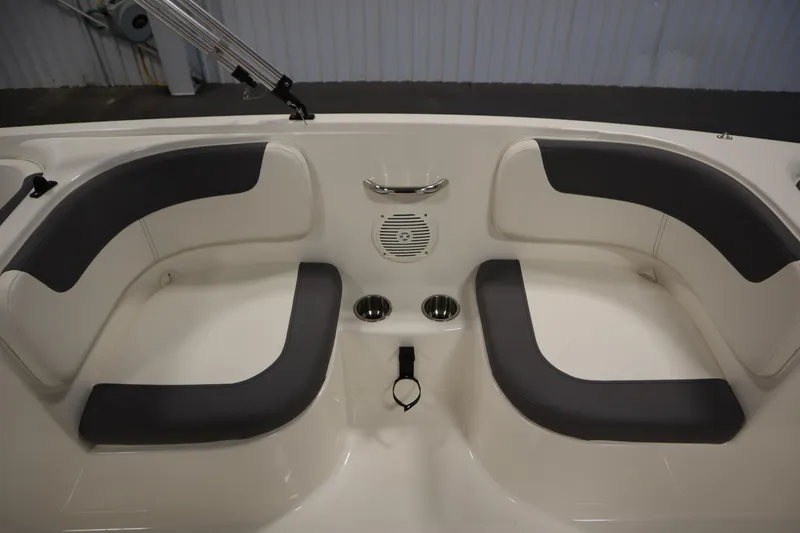 Slide: The Image of 2022 Bayliner E18 Element boat interior with cushioned seating and cup holders. - 25