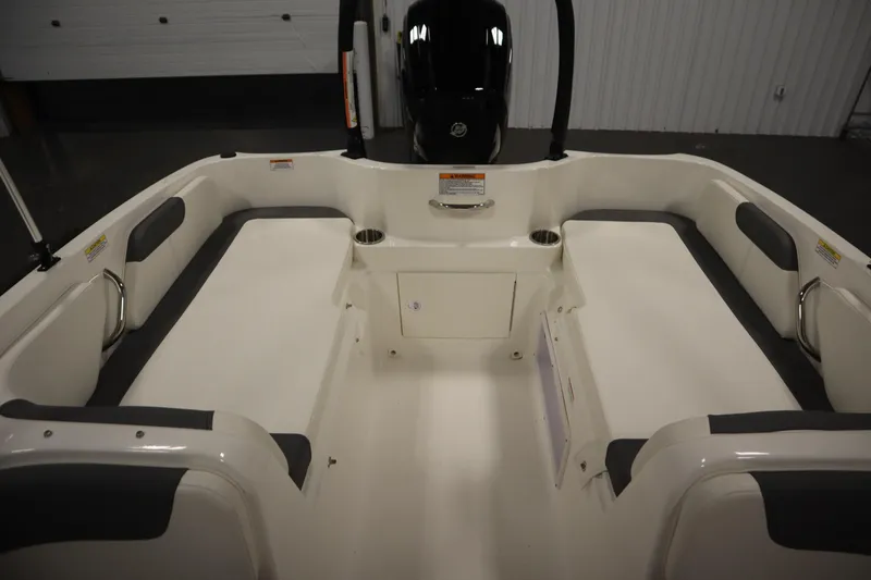 Slide: The Image of 2022 Bayliner E18 Element boat interior with seating and storage compartments. - 28