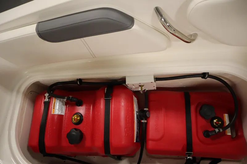 Slide: The Image of 2022 Bayliner E18 Element boat with dual red fuel tanks in storage compartment. - 29