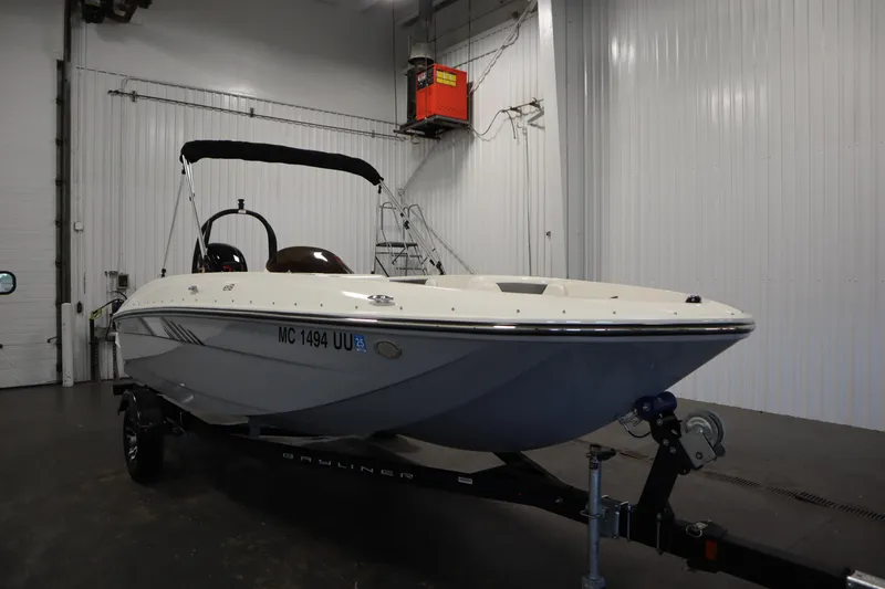 Slide: The Image of 2022 Bayliner E18 Element boat in indoor storage on trailer. - 3