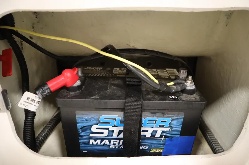 Slide: The Image of Battery compartment of 2022 Bayliner E18 Element boat with Super Start marine battery. - 31