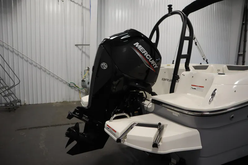 Slide: The Image of 2022 Bayliner E18 Element boat with Mercury outboard motor in a storage facility. - 35