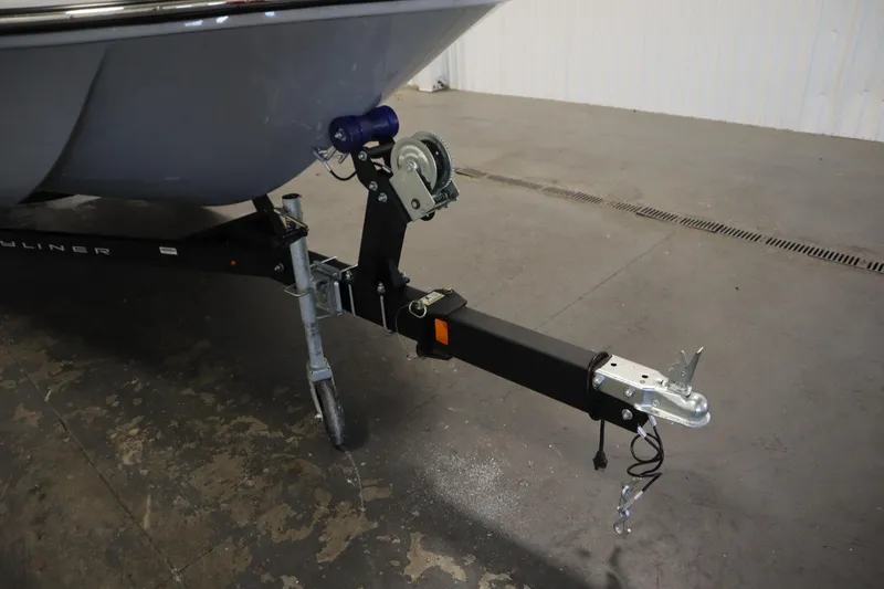 Slide: The Image of 2022 Bayliner E18 Element boat trailer hitch in a garage setting. - 38