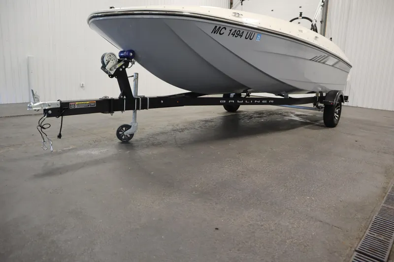 Slide: The Image of 2022 Bayliner E18 Element boat on trailer in indoor setting. - 39