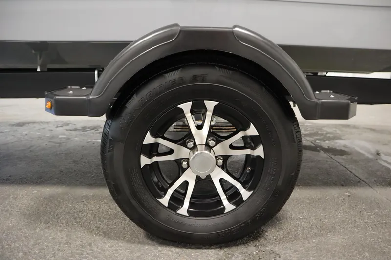 Slide: The Image of 2022 Bayliner E18 Element trailer wheel with sleek black and silver alloy design. - 40