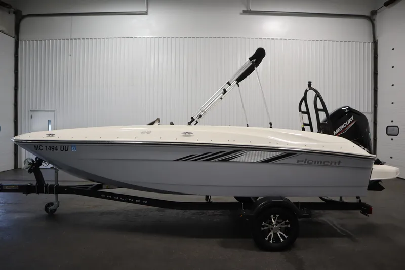 Slide: The Image of 2022 Bayliner E18 Element boat on trailer in indoor storage. - 8