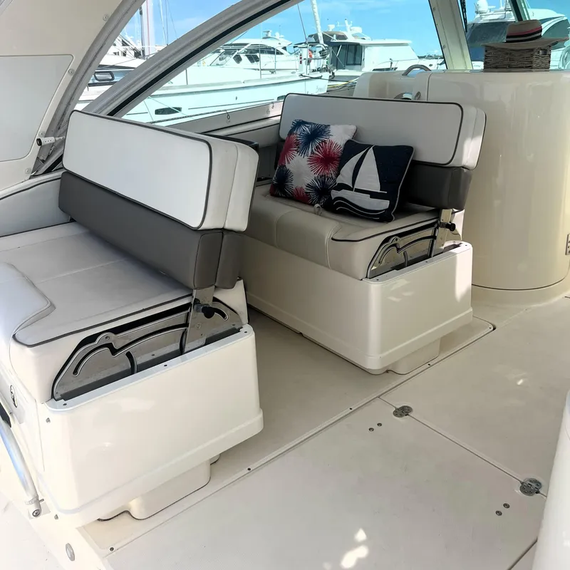 Slide: The Image of 2016 World Cat 320 DC interior with cushioned seating and decorative pillows. - 22